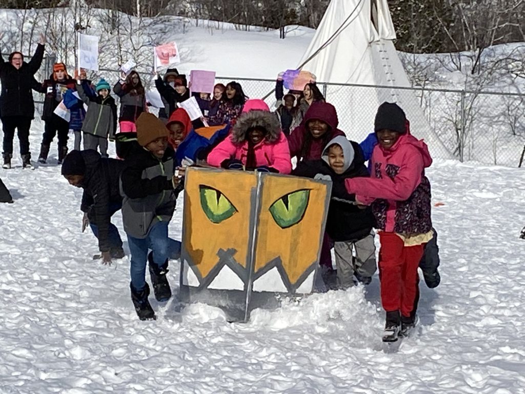 students with their cardboard sled